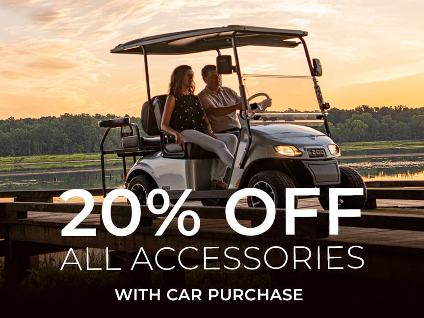 Couple in golf car with 20% off all accessories text overlay